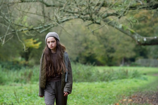 Molly walking in woods - still from movie
