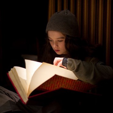 Molly discovers the book Hypnotism an Ancient Art Explained - still from movie